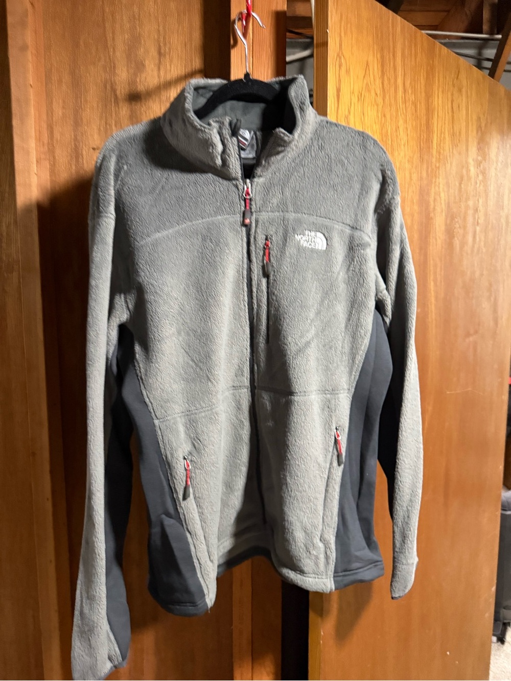 The North Face Gray Fleece Jacket with Dark Gray Panels and Red Accents